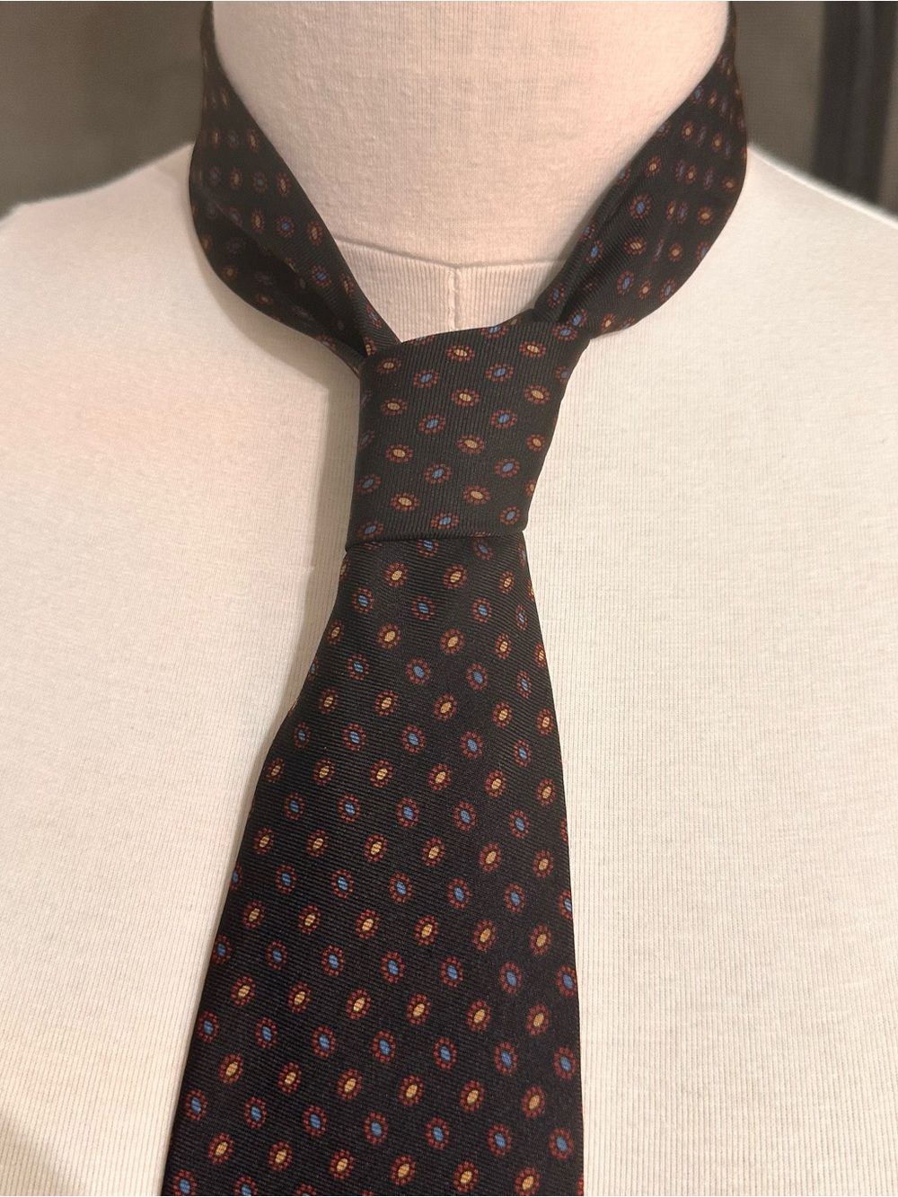 Classic Black Men's Silk Tie with Orange and Blue Medallion Pattern Brooks
